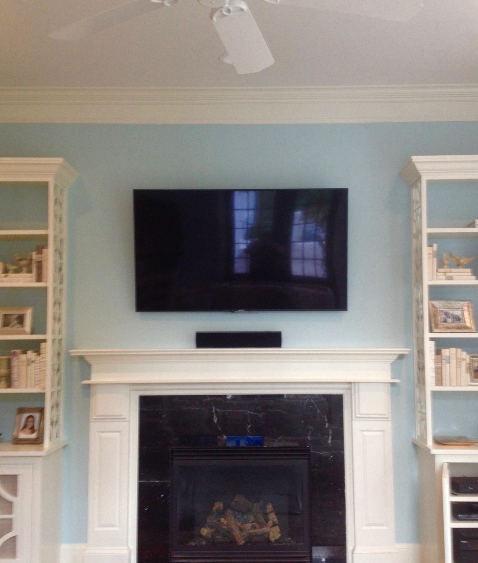 SONY Television and Soundbar over Fireplace